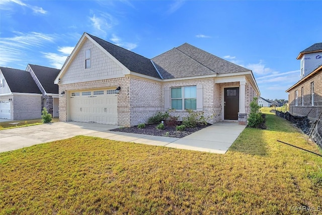 view of front of home featuring a garage and a front yard