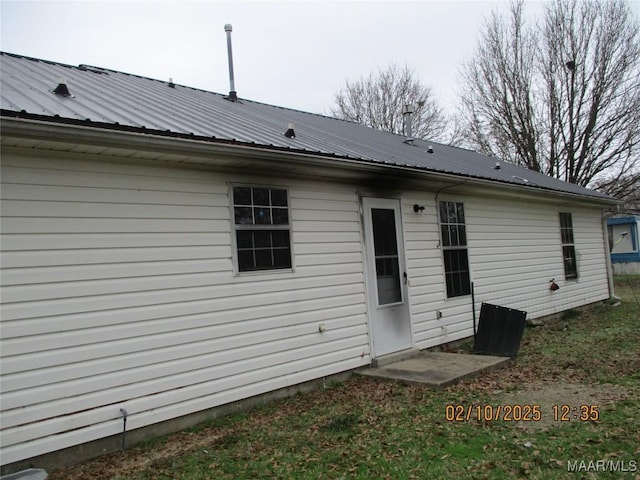 back of property with metal roof