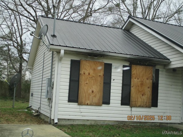 view of home's exterior with metal roof