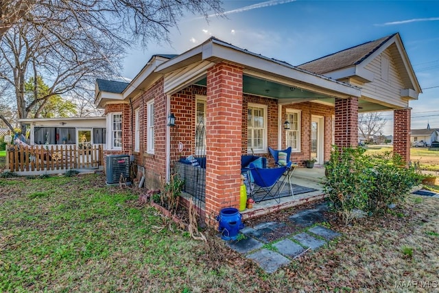 view of side of property with central AC unit