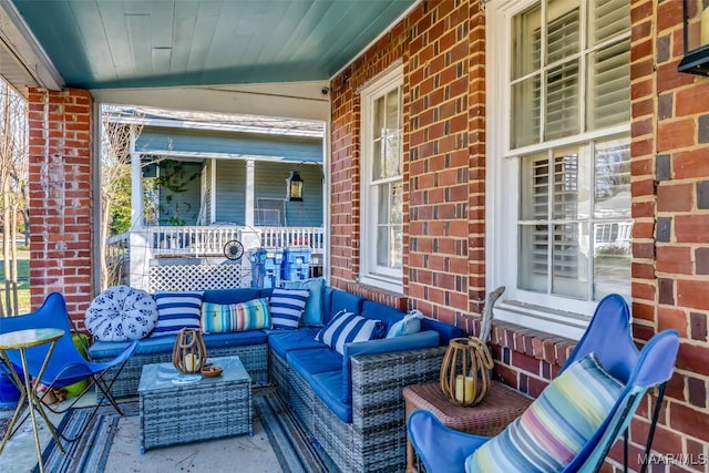 view of patio featuring covered porch and outdoor lounge area