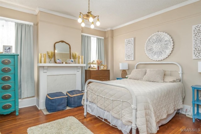 bedroom with ornamental molding, a chandelier, and dark hardwood / wood-style floors