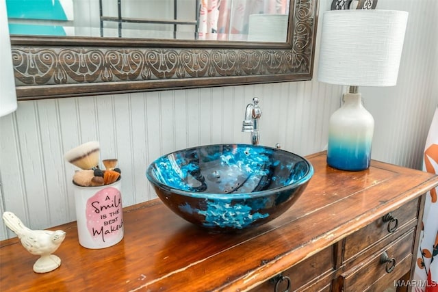 room details with vanity and a hot tub