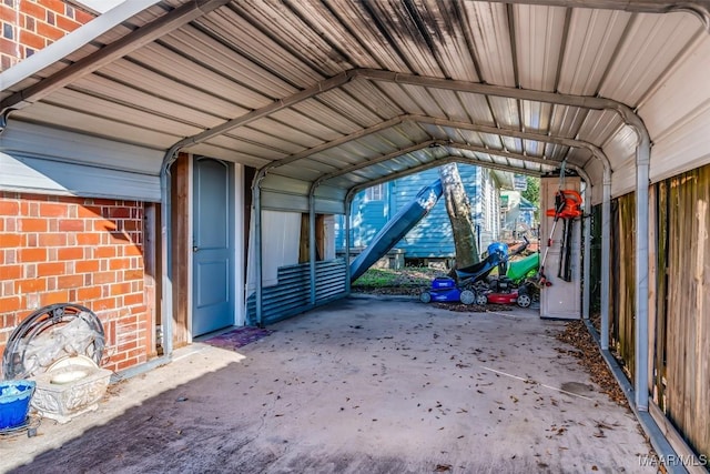 view of vehicle parking with a carport