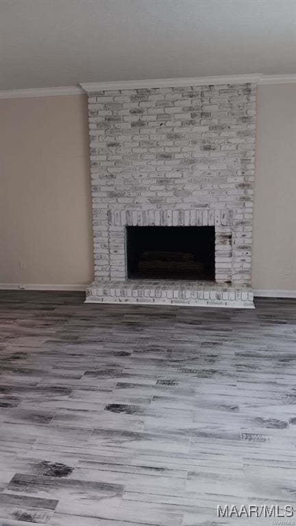 details featuring a fireplace, ornamental molding, and hardwood / wood-style flooring