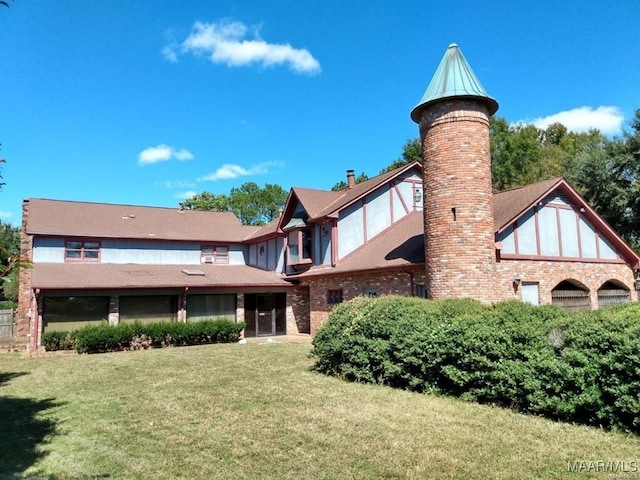 back of house with a yard