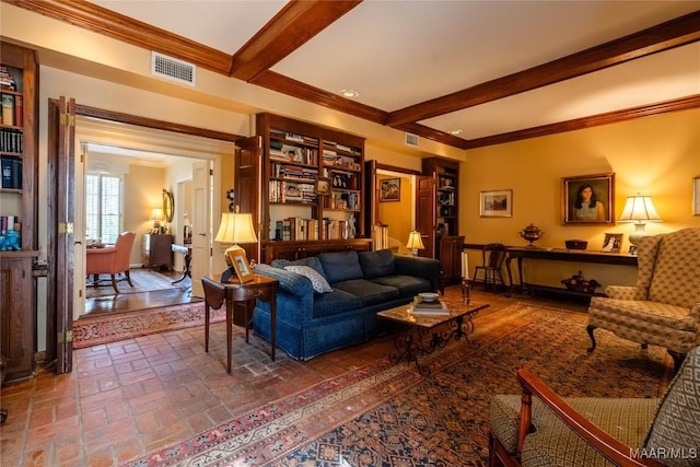 living room featuring brick floor, visible vents, crown molding, and beamed ceiling