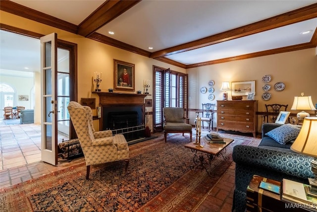 living area with crown molding, a fireplace, and beamed ceiling