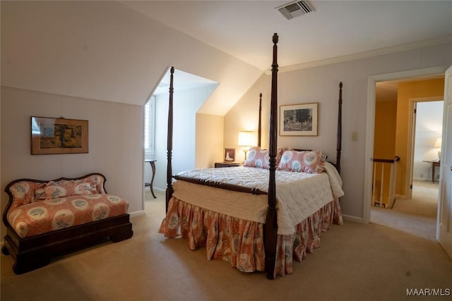 bedroom featuring baseboards, ornamental molding, visible vents, lofted ceiling, and light colored carpet