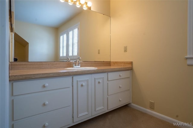 bathroom featuring baseboards and vanity