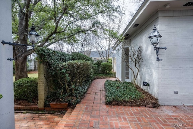 exterior space with visible vents and a patio area