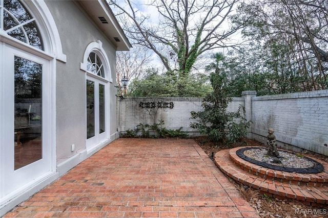 view of patio / terrace featuring visible vents and a fenced backyard