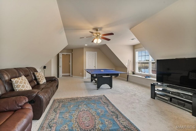 rec room with a ceiling fan, carpet flooring, vaulted ceiling, and baseboards