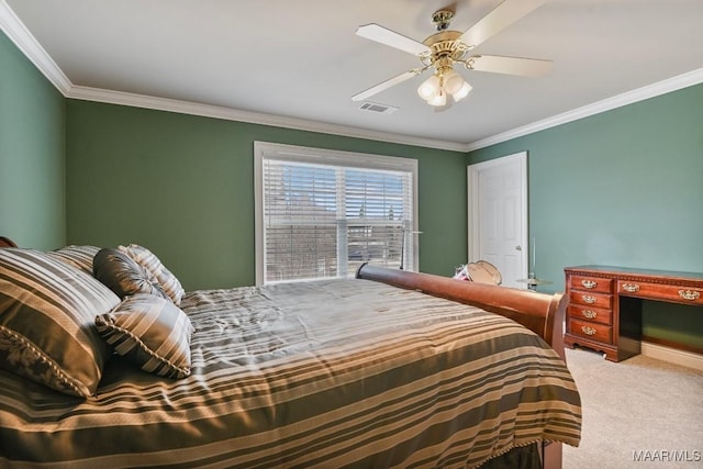 bedroom with carpet floors, crown molding, and ceiling fan
