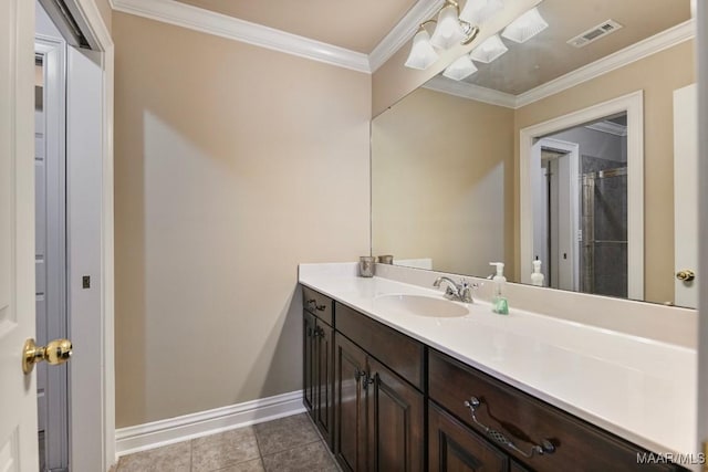 full bathroom featuring baseboards, vanity, ornamental molding, and tile patterned floors