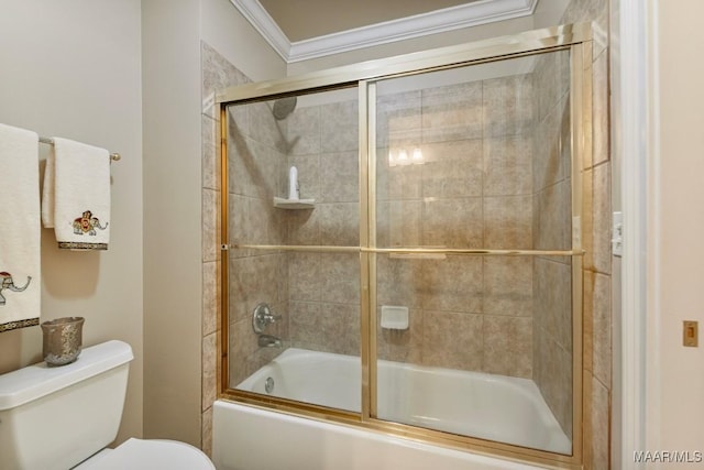 bathroom featuring crown molding, bath / shower combo with glass door, and toilet