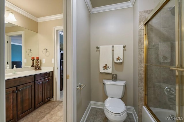 bathroom featuring crown molding, tile patterned floors, baseboards, vanity, and toilet