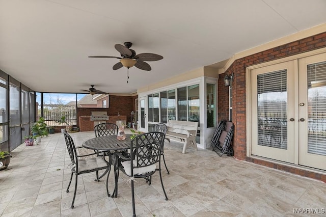 view of patio / terrace with french doors, outdoor dining area, ceiling fan, and grilling area