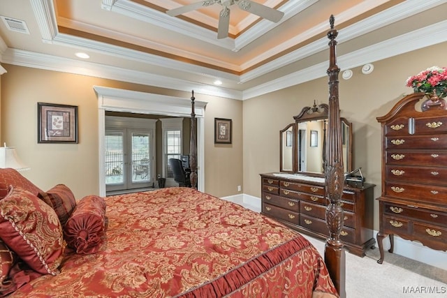 bedroom with ornamental molding, french doors, carpet, ceiling fan, and a raised ceiling