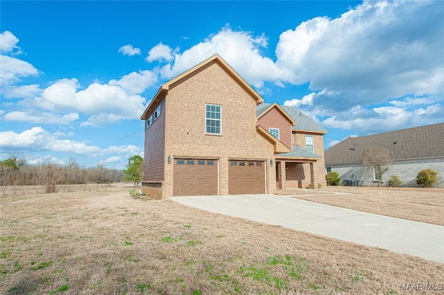 view of front facade featuring a garage, brick siding, and driveway