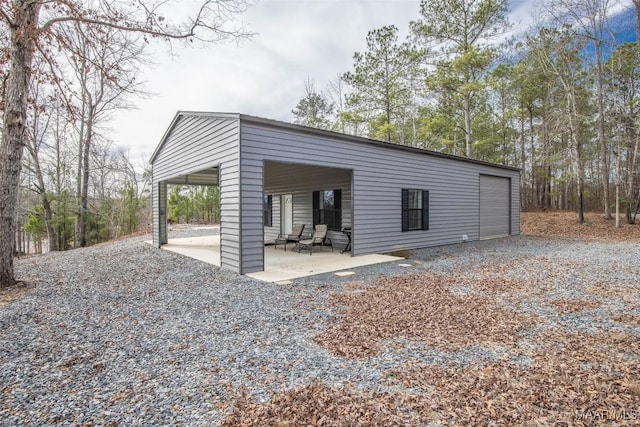 garage with gravel driveway