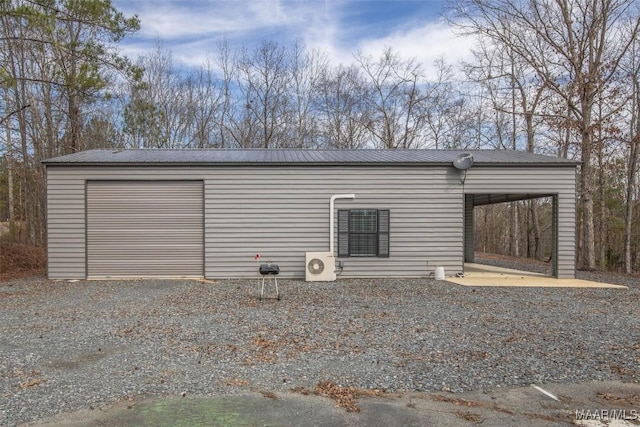 garage with gravel driveway