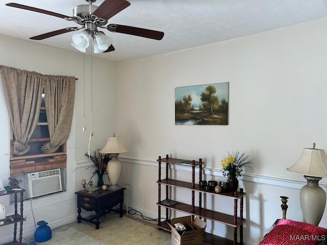 interior space with cooling unit, a textured ceiling, and baseboards