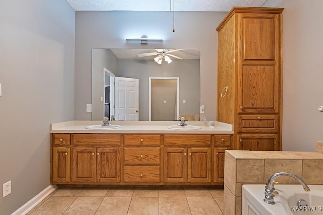 bathroom with ceiling fan, double vanity, and a sink