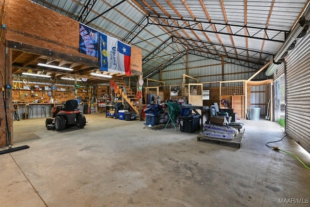 garage featuring a workshop area and metal wall