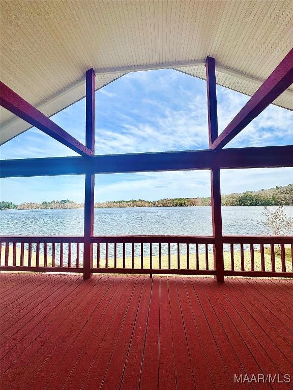 wooden deck with a water view