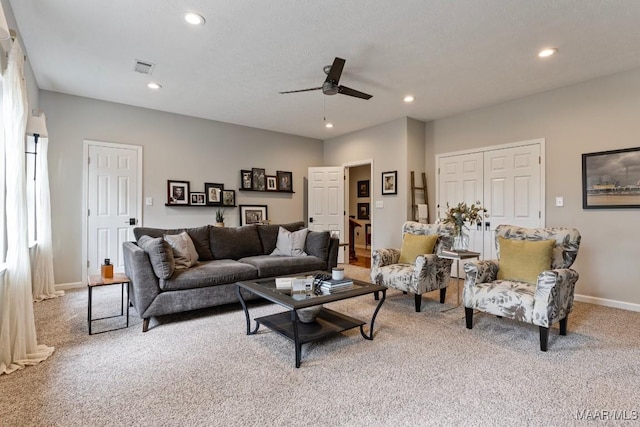 living area featuring recessed lighting, light colored carpet, visible vents, a ceiling fan, and baseboards