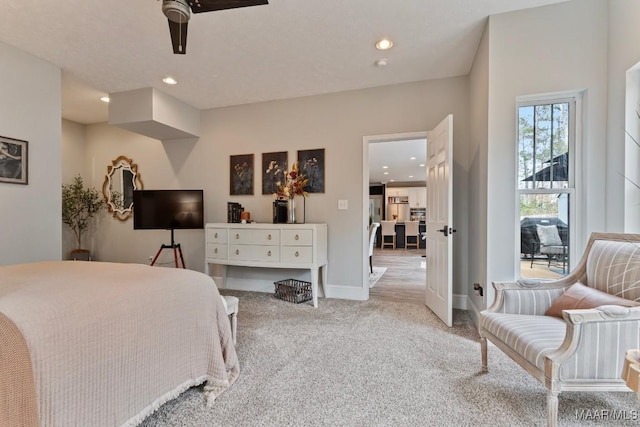 bedroom featuring recessed lighting, baseboards, a ceiling fan, and light colored carpet