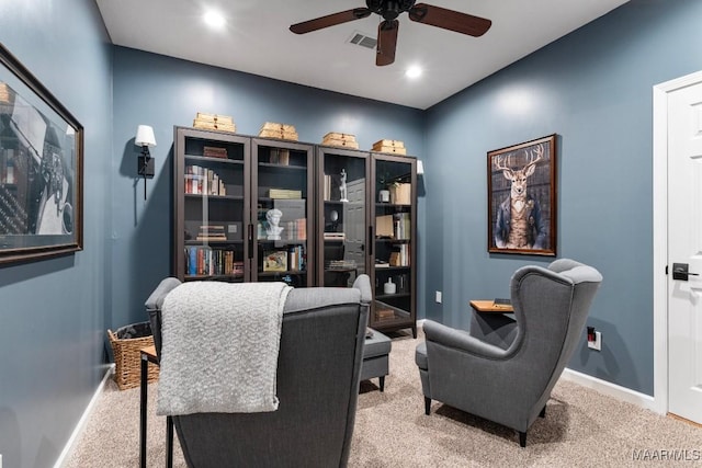 sitting room featuring light carpet, baseboards, visible vents, a ceiling fan, and recessed lighting