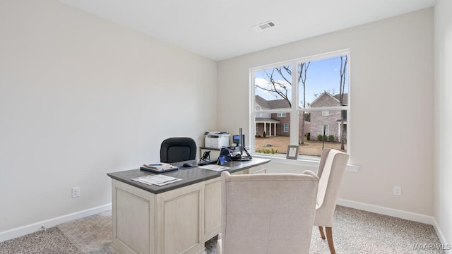 office with light carpet, baseboards, and visible vents