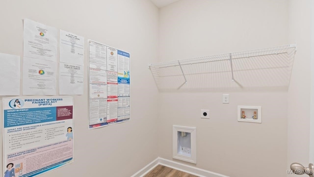 laundry room with hookup for a washing machine, baseboards, wood finished floors, laundry area, and electric dryer hookup