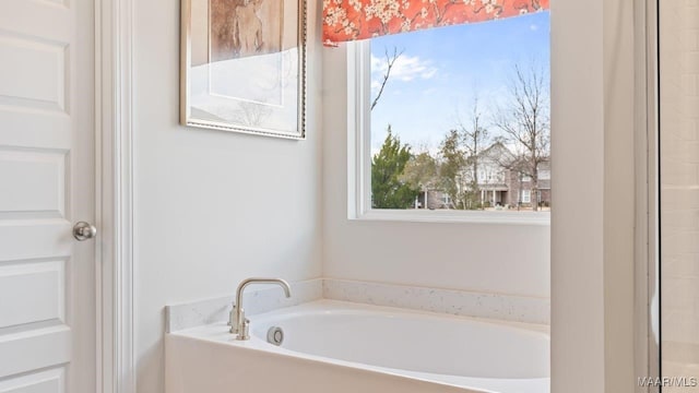 bathroom featuring a garden tub