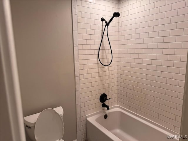 bathroom featuring shower / washtub combination and toilet