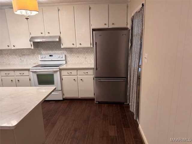 kitchen featuring dark wood finished floors, white range with electric cooktop, white cabinets, high quality fridge, and under cabinet range hood