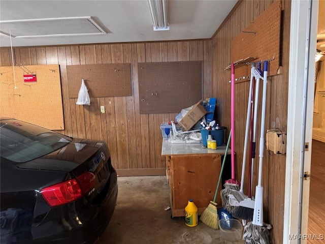 garage featuring wood walls