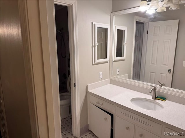 bathroom with tile patterned floors and vanity