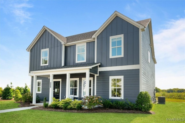 view of front of house featuring board and batten siding, central AC, a porch, and a front lawn