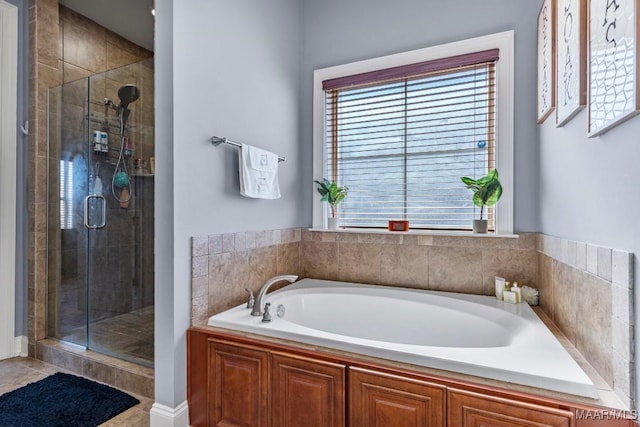 bathroom featuring a bath and a shower stall