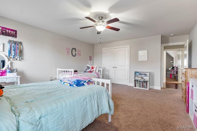 bedroom with a closet, baseboards, ceiling fan, and carpet floors