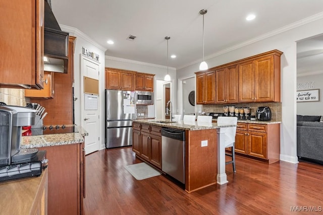 kitchen with visible vents, brown cabinets, a sink, dark wood-style floors, and appliances with stainless steel finishes