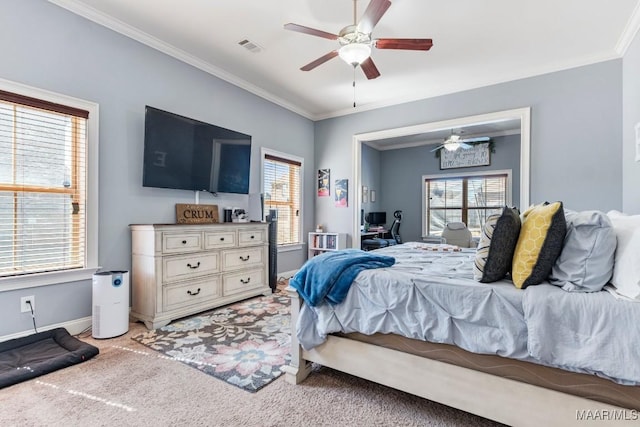 bedroom with baseboards, light colored carpet, ornamental molding, and a ceiling fan