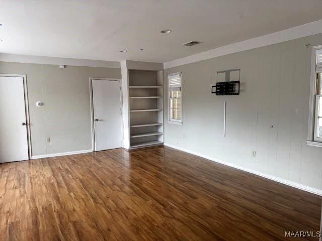 3110 Highfield Dr, Montgomery, AL 36111 - unfurnished room featuring baseboards, built in shelves, visible vents, and wood finished floors