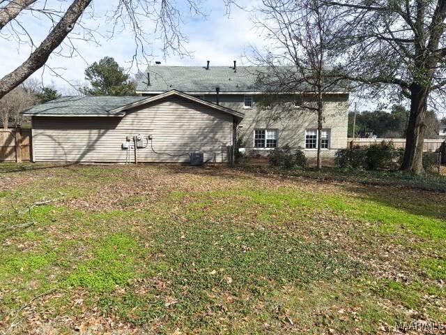 3110 Highfield Dr, Montgomery, AL 36111 - back of property featuring a yard and fence