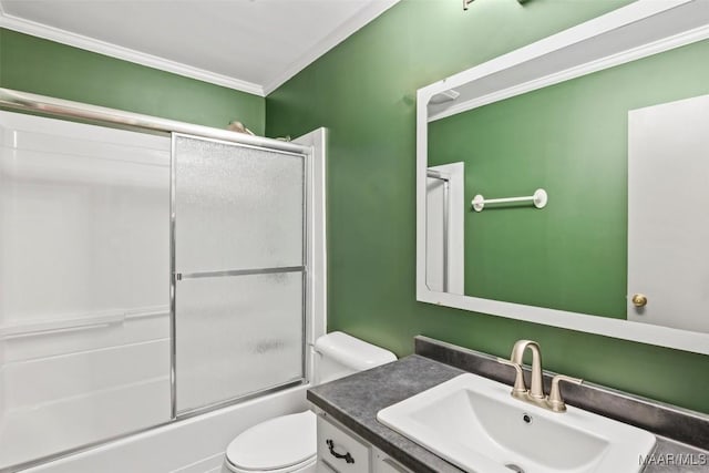 bathroom with toilet, ornamental molding, combined bath / shower with glass door, and vanity