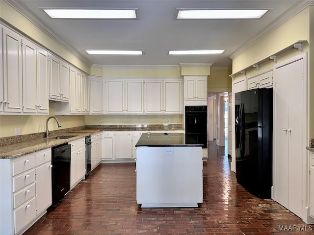 kitchen featuring black appliances, ornamental molding, a sink, and white cabinets