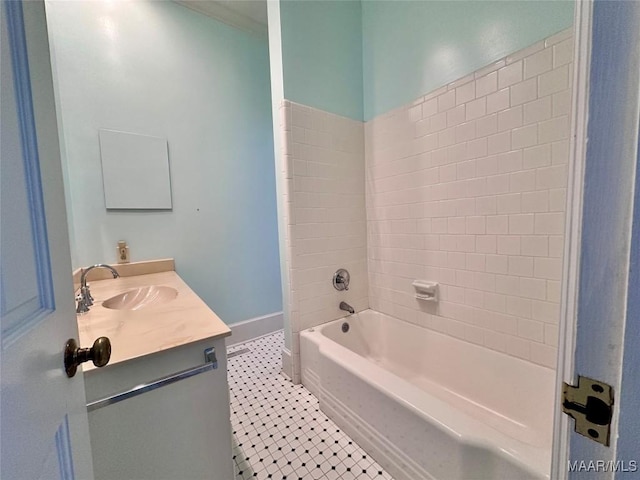 bathroom with shower / bathing tub combination, vanity, baseboards, and tile patterned floors